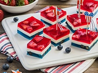 Red, White & Blue Gelatin Squares by LA LECHERA, layered with red and blue gelatin, sweetened condensed milk, with fruits