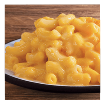 Macaroni and cheese on a white plate and wooden table top.