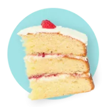 A three layered cake with vanilla frosting and strawberry jam between layers on a blue circle.